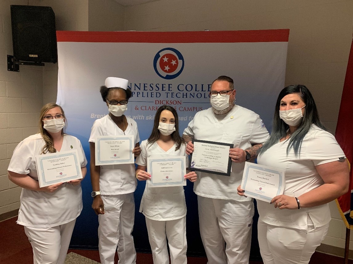 Lyndsay Baker, Joyce White, Addison Lucas, Shane VanDeweghe and Stacey Burdick (left to right) display their certificates of achievement presented during the pinning ceremony.