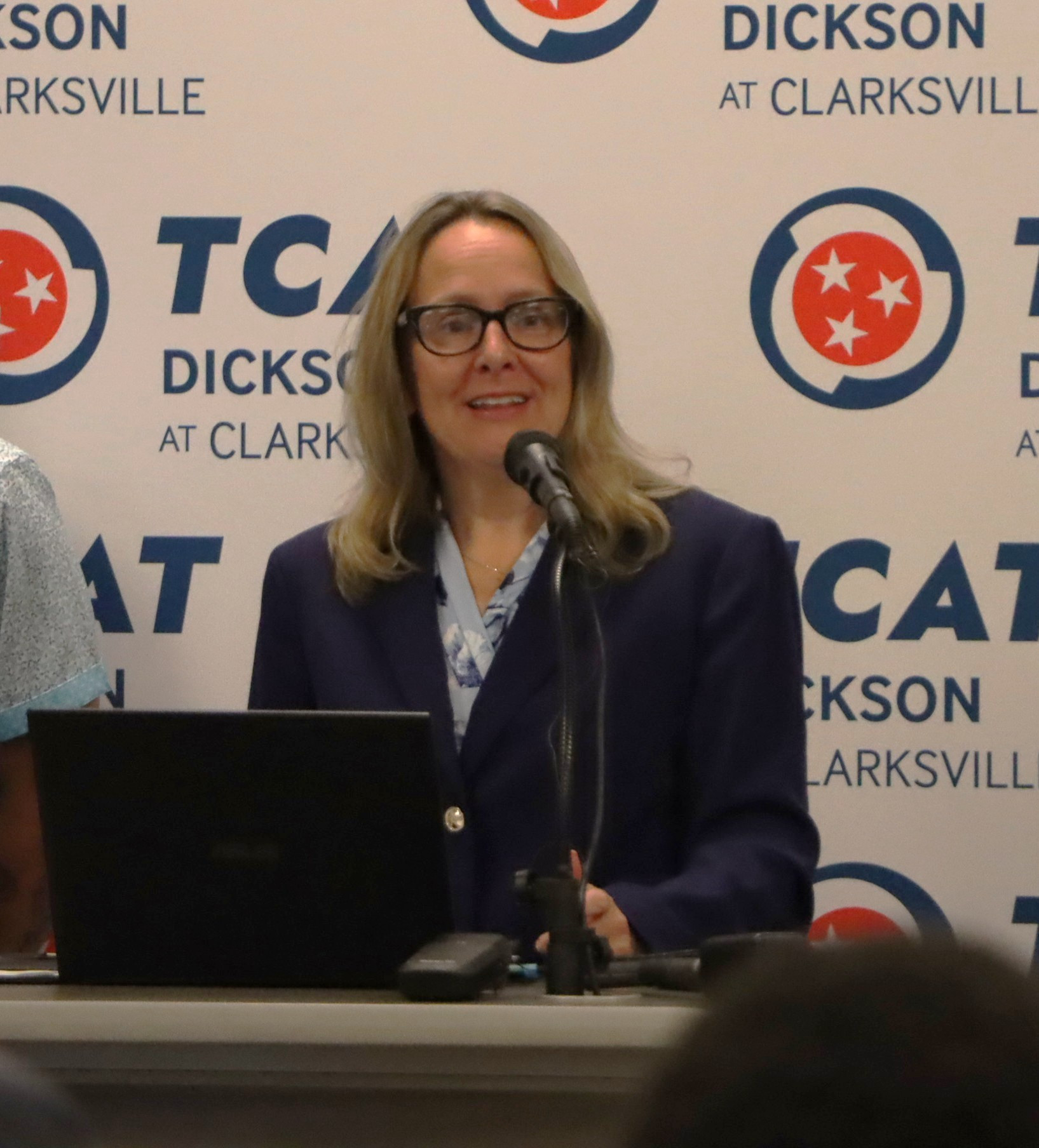 Photo of President Travis announcing Tile Manufacturing Operator program.